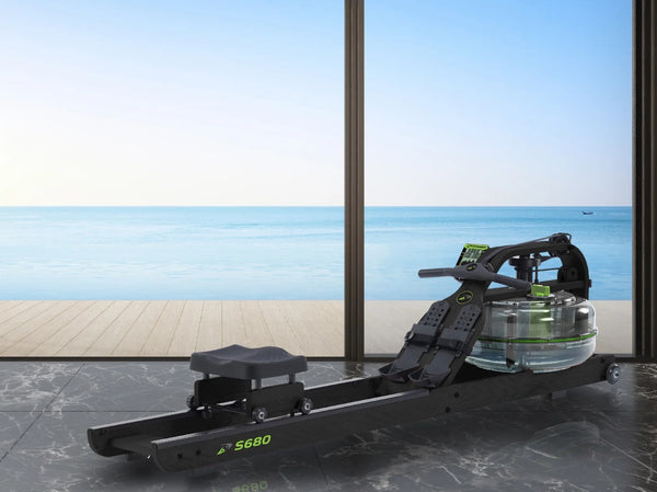 Front View Of The Dynamic Fluid Fitness S680 Rower In A Home Setting With Ocean In The Background